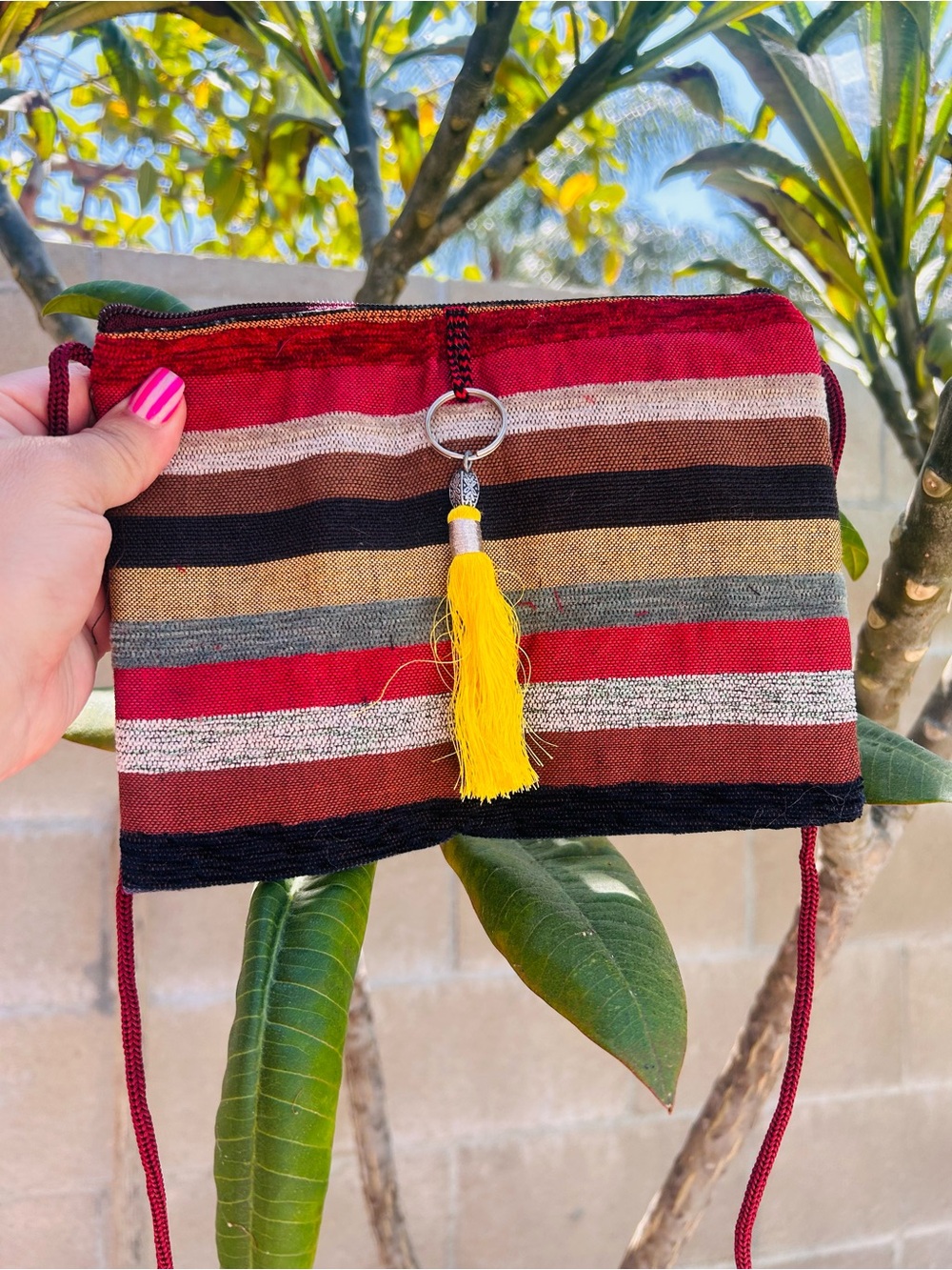 Striped Multicolor Crossbody Bag with Yellow Tassel Accent